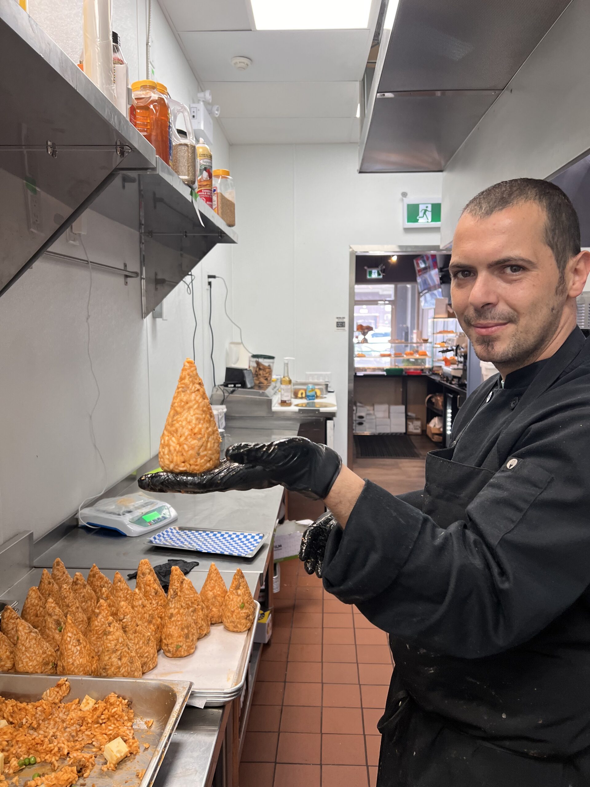 Giacomo showing how he handcraft arancini catanesi